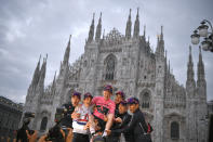 Britain’s Tao Geoghegan Hart is backdropped by the gothic cathedral as he celebrates with teammates after winning the Giro d'Italia cycling race, in Milan, Italy, Sunday, Oct. 25, 2020. In one of the most exciting final stages of a Grand Tour, British rider Tao Geoghegan Hart won the Giro d’Italia on Sunday, edging out Australian Jai Hindley by just 39 seconds. (Marco Alpozzi/LaPresse via AP)