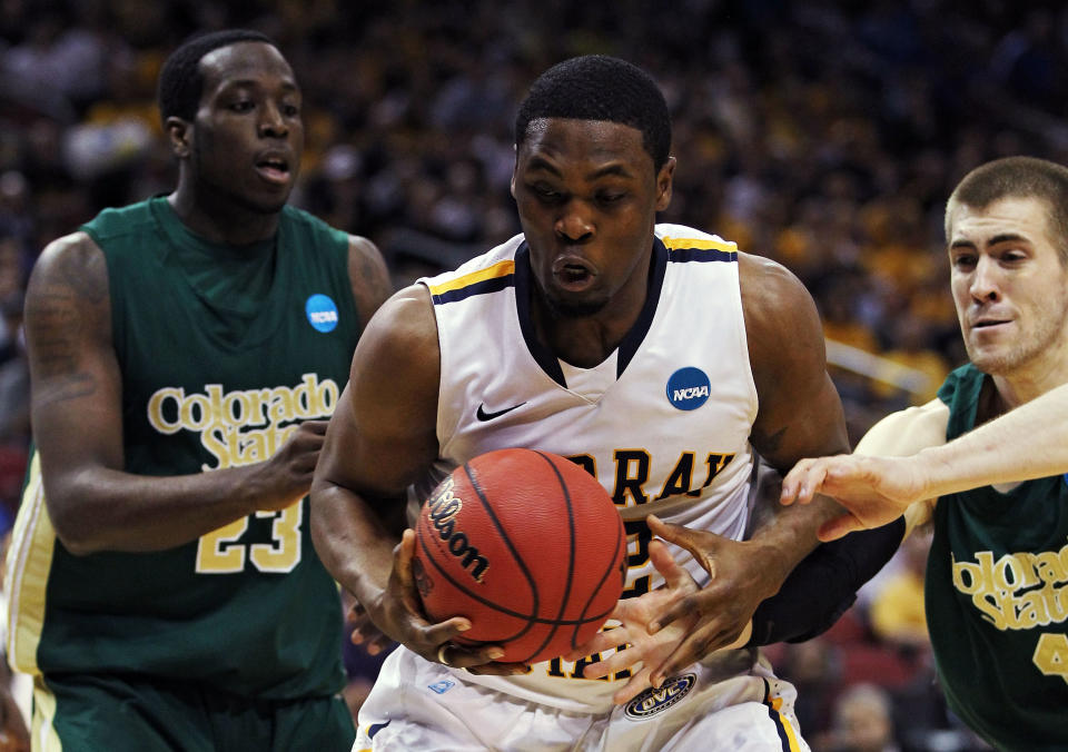 LOUISVILLE, KY - MARCH 15: Ivan Aska #42 of the Murray State Racers fights for the ball against Will Bell #23 and Pierce Hornung #4 of the Colorado State Rams during the second round of the 2012 NCAA Men's Basketball Tournament at KFC YUM! Center on March 15, 2012 in Louisville, Kentucky. (Photo by Andy Lyons/Getty Images)