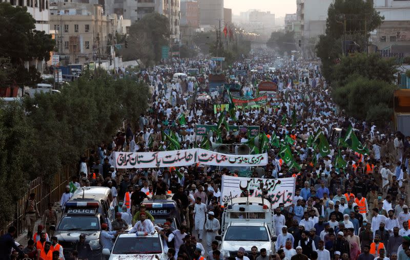 People protest against the cartoon publications of Prophet Mohammad in France during a rally to mark the birth anniversary of Prophet Mohammad, in Karachi