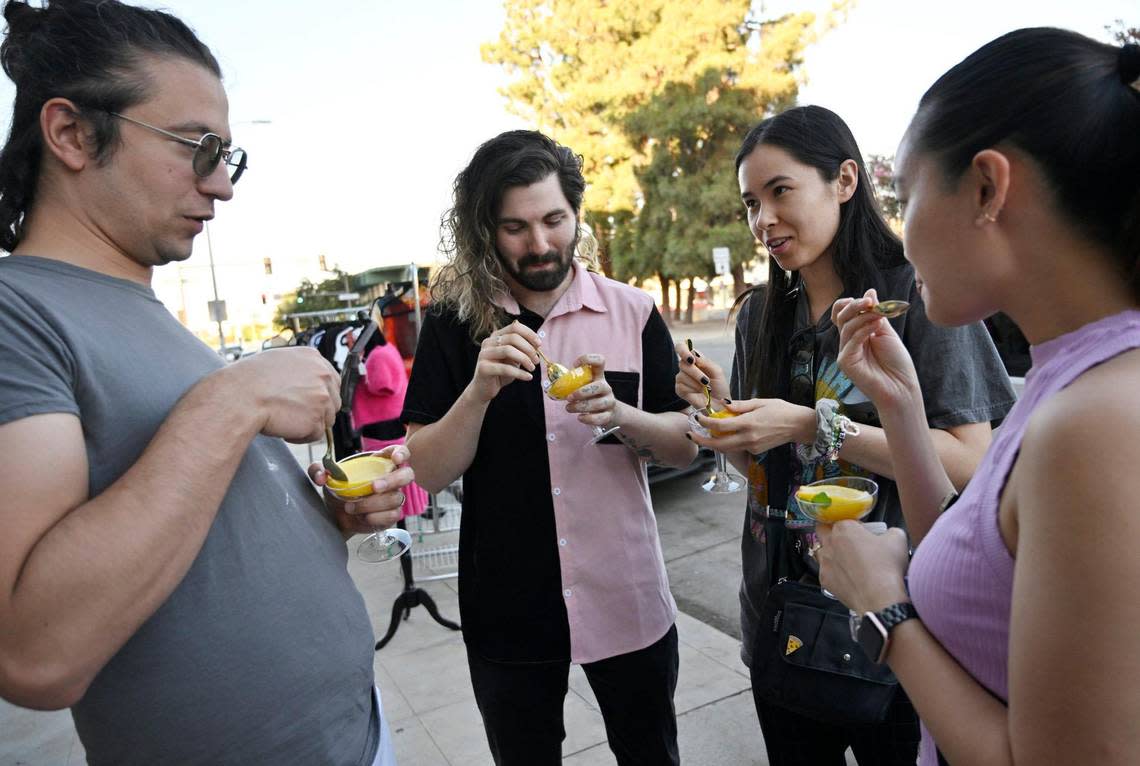 Samples of Lemon Granita Italian ice from Gelateria Del Centro’s sneak preview are enjoyed during ArtHop Thursday, Aug. 3, 2023.