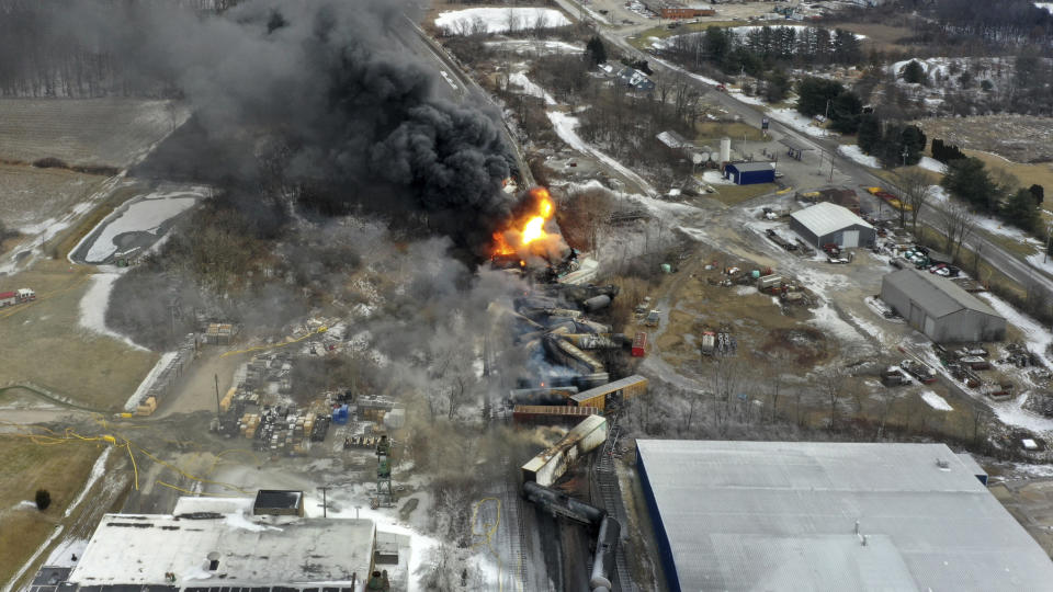 FILE - This photo taken with a drone shows portions of a Norfolk Southern freight train that derailed Friday night in East Palestine, Ohio, are still on fire at mid-day Saturday, Feb. 4, 2023. CEO Alan Shaw told the railroad's employees in a letter Thursday, Sept. 14, 2023, that Norfolk Southern will take several immediate steps in response to the initial report Atkins Nuclear Secured delivered including strengthening the way it responds to any safety incident and establishing a dedicated team to work on implementing the consultant's recommendations. (AP Photo/Gene J. Puskar, File)