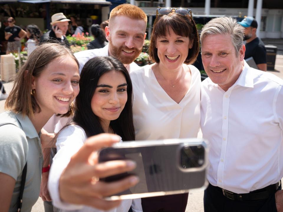 Keir Starmer and shadow chancellor Rachel Reeves campaigning in Uxbridge with Danny Beales (PA)