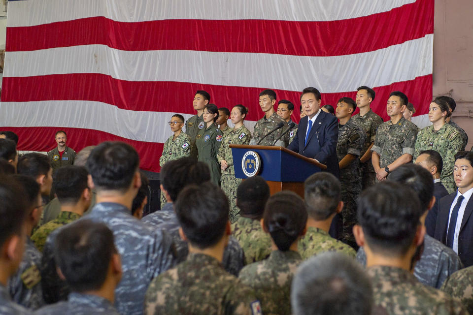 In this photo provided by U.S. Navy, South Korean President Yoon Suk Yeol gives remarks aboard the Nimitz-class aircraft carrier USS Theodore Roosevelt (CVN 71) in Busan, South Korea, Tuesday, June 25, 2024. The newly-inaugurated Freedom Edge exercise is wrapping up in the East China Sea, having brought together Japanese, South Korean and American naval assets for multi-domain maneuvers for the first time. (Mass Communication Specialist Seaman Aaron Haro Gonzalez/U.S. Navy via AP)