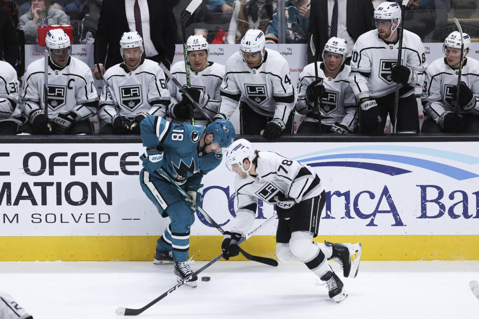 San Jose Sharks right wing Filip Zadina (18) and Los Angeles Kings right wing Alex Laferriere (78) vie for the puck during the third period of an NHL hockey game Thursday, April 4, 2024, in San Jose, Calif. The Kings won 2-1. (AP Photo/Benjamin Fanjoy)