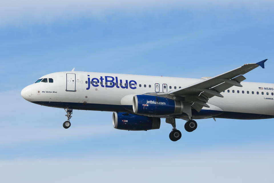 JetBlue Airways Airbus A320-200 aircraft as seen on final approach landing at New York John F. Kennedy International Airport in USA. The airplane has the registration N580JB, 2x IAE jet engines and the name Mo Better Blue . Jet Blue B6 JBU is an American low cost airline carrier with a fleet of 256 airliners and headquarters in Long Island City in NYC borough of Queens with main hub base JFK KJFK airport. (Photo by Nicolas Economou/NurPhoto via Getty Images)
