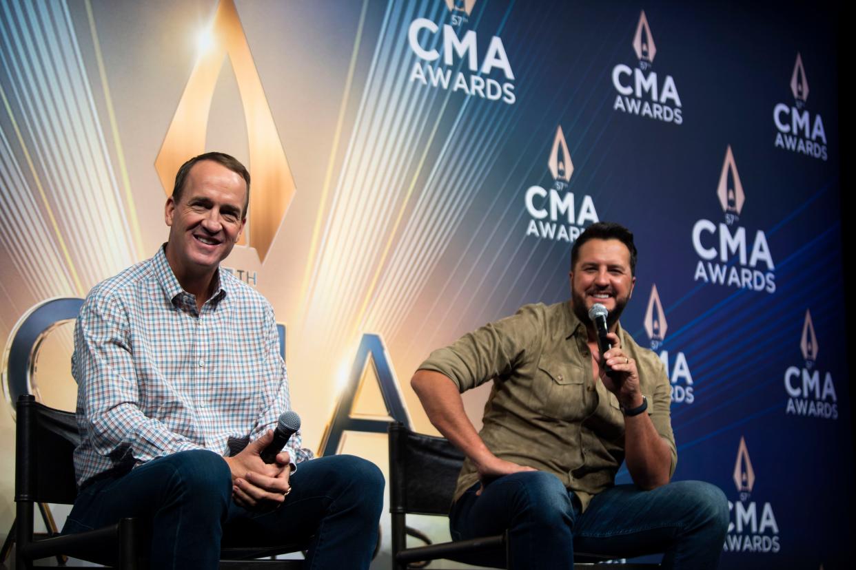 CMA Awards show hosts Peyton Manning, left, and Luke Bryan banter during a press conference at Bridgestone Arena in November.