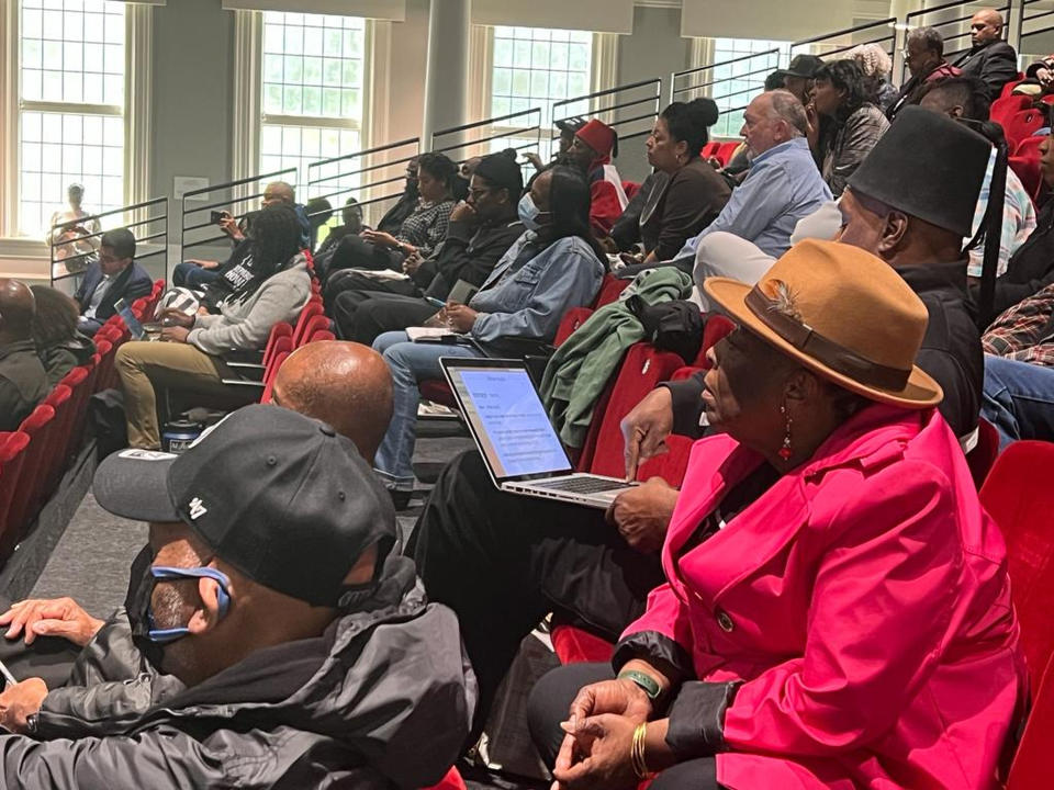 People listen to the California reparations task force, a nine-member committee studying restitution proposals for African Americans, at a meeting at Lesser Hall in Mills College at Northeastern University in Oakland, Calif., on Saturday, May 6, 2023. The panel began voting Saturday on recommendations for how the state may compensate and apologize to Black Californians for generations of harm caused by discriminatory policies. (AP Photo/Sophie Austin)