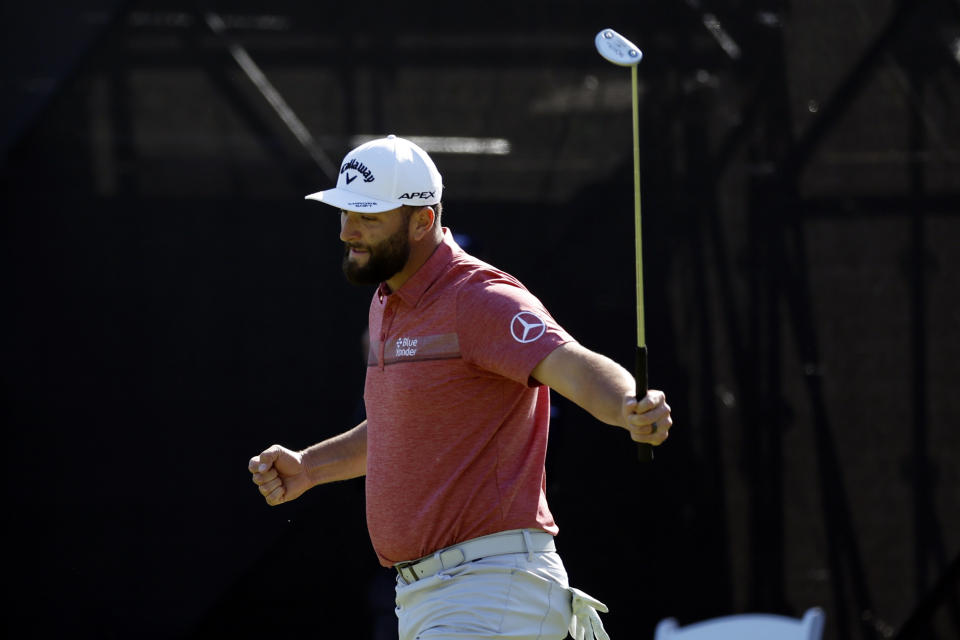 Jon Rahm reacts after a birdie putt on the 14th hole during the final round of the Genesis Invitational golf tournament at Riviera Country Club, Sunday, Feb. 19, 2023, in the Pacific Palisades area of Los Angeles. (AP Photo/Ryan Kang)