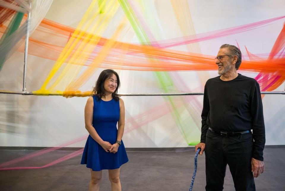 Seongmin Yoo, left, a Korean-born conceptual and installation artist, stands with Stephen Kaltenbach, a former Sacramento State professor renowned as a sculptor and for his conceptual work, inside the cube of their collaboration, “Epicenter” earlier this month at the John Natsoulas Gallery in Davis.