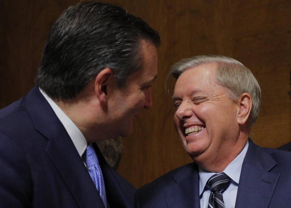 Sen. Lindsey Graham (R-S.C.) laughs with Sen. Ted Cruz (R-Texas) at the conclusion of testimony from Supreme Court nominee Brett Kavanaugh and Dr. Christine Blasey Ford, who accuses Kavanaugh of sexually assaulting her. (Photo: Pool via Getty Images)