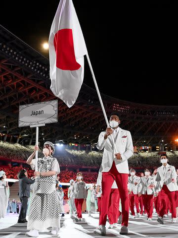 <p>Matthias Hangst/Getty</p> Yui Susaki and Rui Hachimura of Team Japan lead their team out during the Opening Ceremony of the Tokyo 2020 Olympic Games on July 23, 2021.