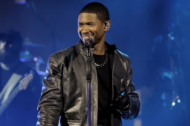 <p>Kevin Winter/Getty Images</p> Usher performs in Inglewood in August 2023