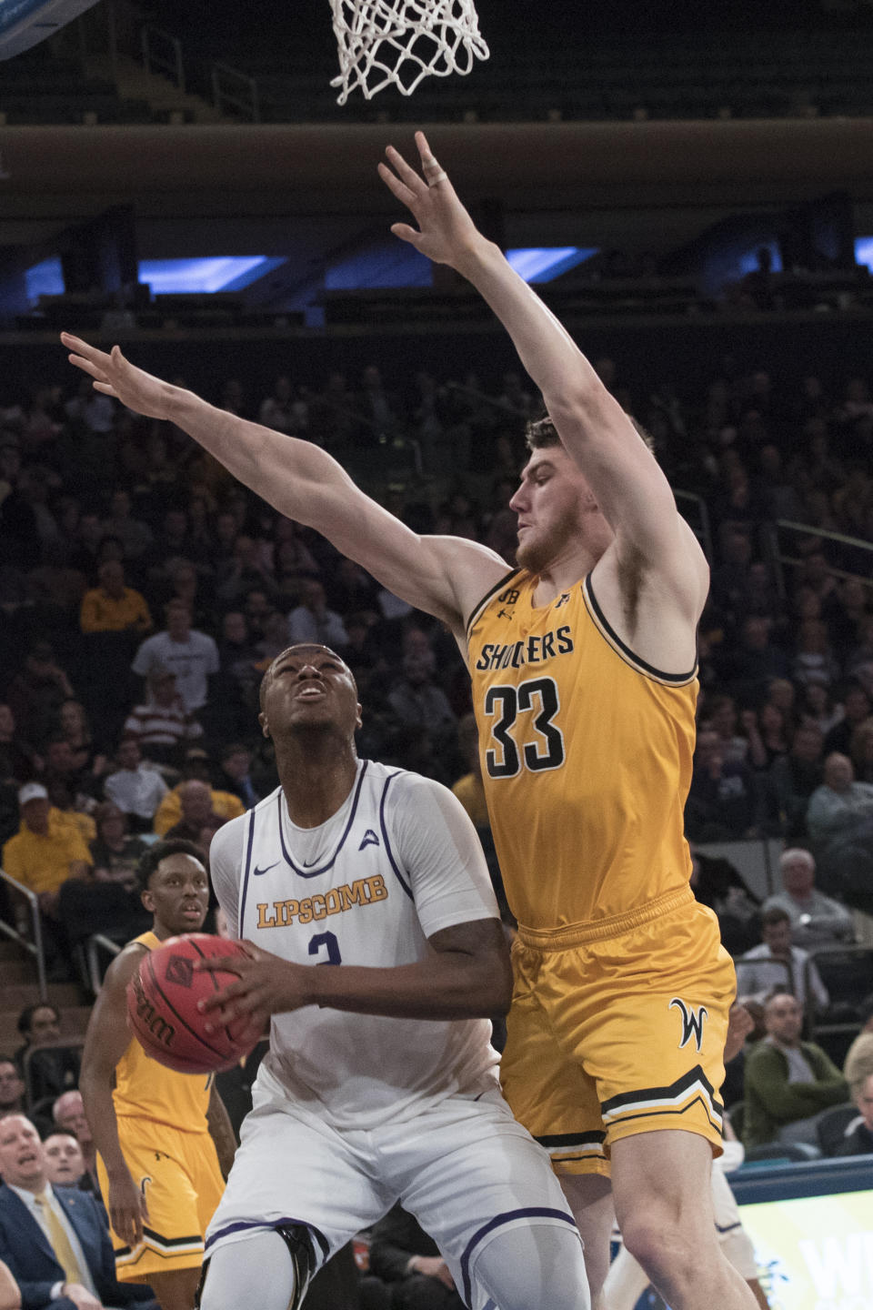 Wichita State center Asbjorn Midtgaard (33) guards Lipscomb center Ahsan Asadullah (2) during the first half of a semifinal college basketball game in the National Invitational Tournament, Tuesday, April 2, 2019, at Madison Square Garden in New York. (AP Photo/Mary Altaffer)