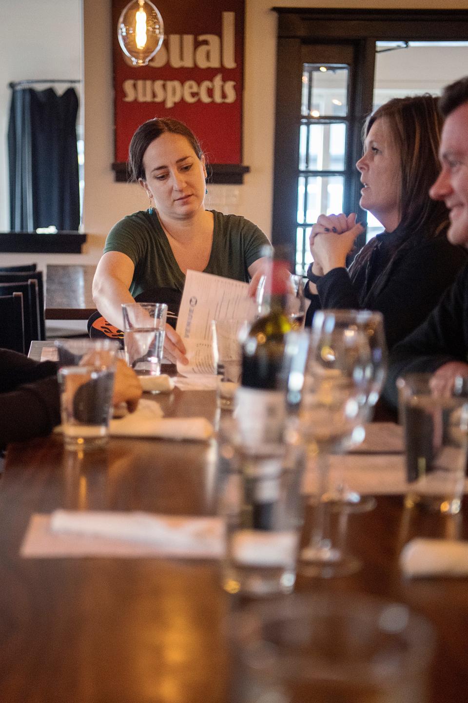 Rachel Gordon collects menus after taking food orders from a group of eight at Avenue M, February 7, 2024.