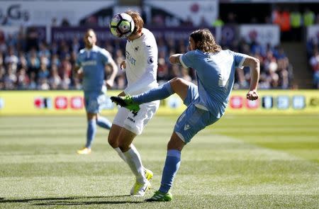 Britain Soccer Football - Swansea City v Stoke City - Premier League - Liberty Stadium - 22/4/17 Stoke City's Joe Allen in action with Swansea City's Ki Sung Yueng Action Images via Reuters / Peter Cziborra Livepic