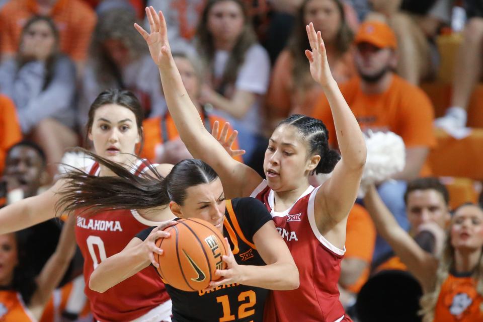 Oklahoma State Cowgirls guard Claire Chastain (12) tries to bet past Oklahoma Sooners guard Skylar Vann (24) during a women's Bedlam basketball game between the Oklahoma State Cowgirls (OSU) and the Oklahoma Sooners (OU) at Gallagher-Iba Arena in Stillwater, Okla., Saturday, March 4, 2023. Oklahoma won 80-71.