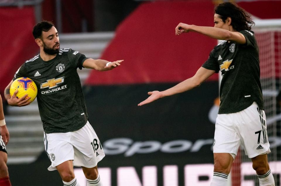 <p>Bruno Fernandes and Edinson Cavani</p> (Manchester United via Getty Imag)