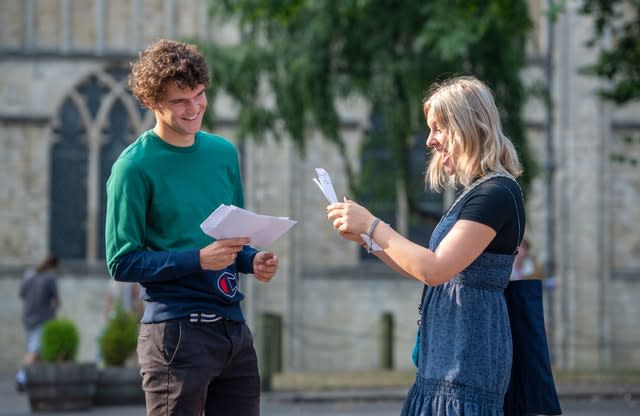 Twins Teddy, left, and Rosy Valentine react as students at Norwich School receive their A-level results 