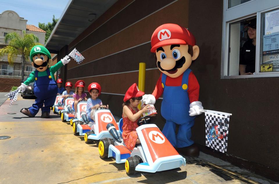 mario and luigi celebrate the release of mario kart 8 at mcdonald's