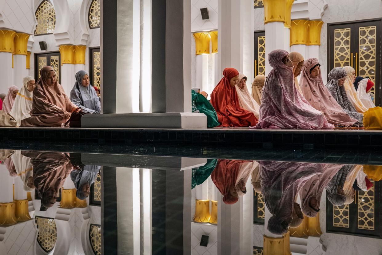 Indonesian Muslims perform Tarawih prayers to mark the start of the holy month of Ramadan at the Sheikh Zayed Solo Grand Mosque on March 22, 2023 in Solo City, Indonesia. Indonesia, which has the world's largest Muslim population, marked the beginning of Ramadan on Thursday with Tarawih prayers.