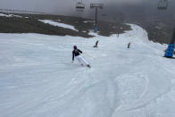 Skiers make the most of the very little snow at the Tūroa ski field, on Mt Ruapehu, New Zealand on Sept. 22, 2022. A disastrous snow season has left two of New Zealand's largest ski fields on the brink of bankruptcy, with climate change appearing to play a significant role. (AP Photo/Nick Perry)