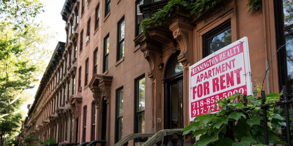 A sign advertises an apartment for rent along a row of brownstone townhouses in the Fort Greene neighborhood in the Brooklyn borough of New York City.