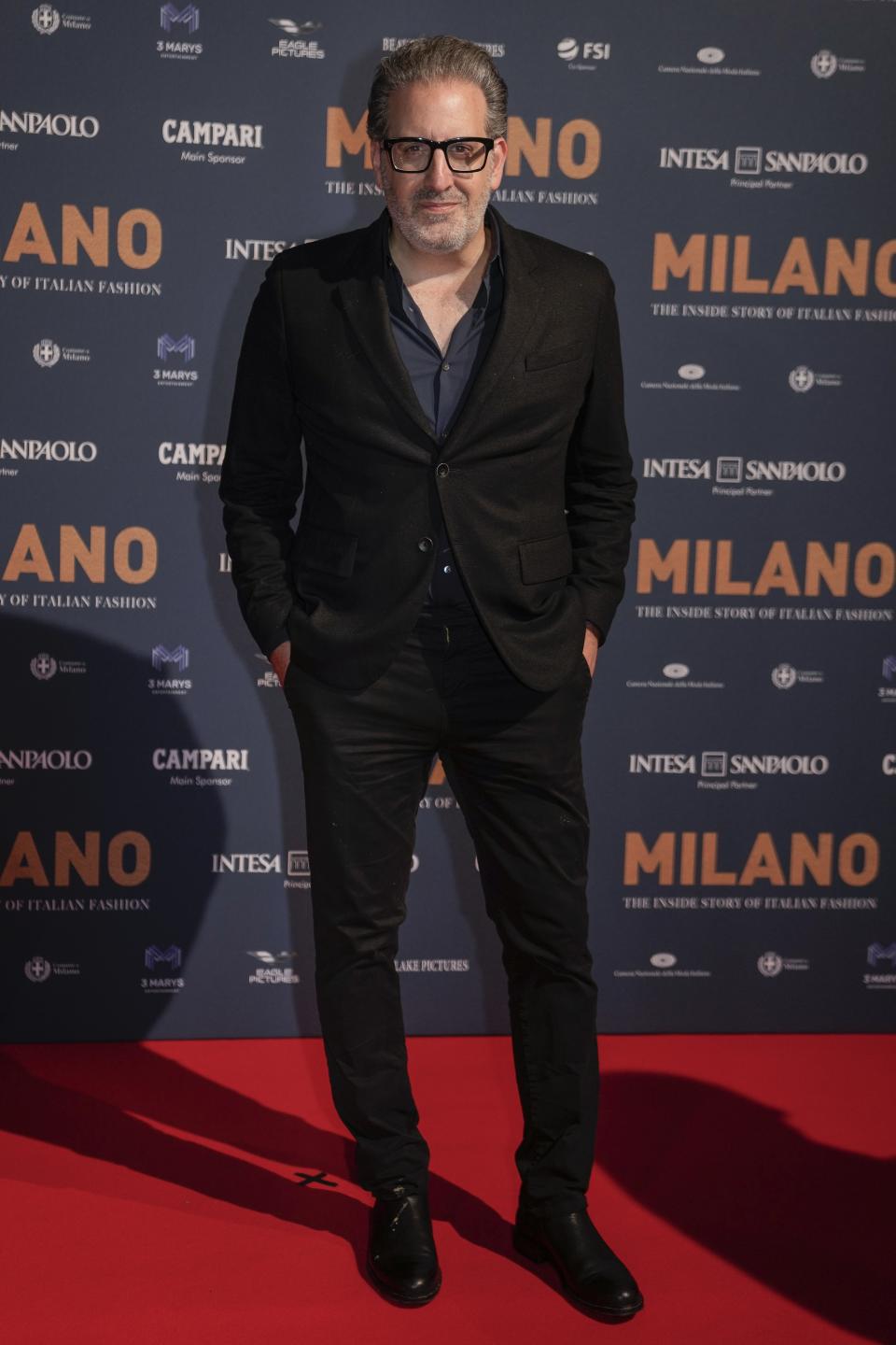 John Maggio poses for photographers upon arrival for the premiere of the film 'Milano, the inside story of Milan Fashion' in Milan, Italy, Sunday, Feb. 26, 2023. (AP Photo/Luca Bruno)