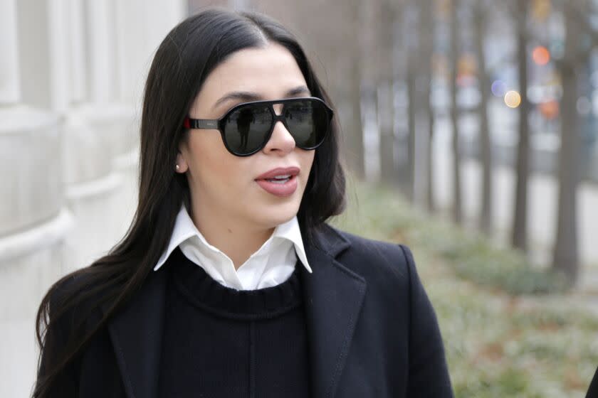 FILE - In this Dec. 6, 2018 file photo, Emma Coronel Aispuro, wife of Joaquin "El Chapo" Guzman, arrives to federal court in New York. Despite her status as the wife of the world's most notorious drug boss, Coronel Aispuro lived mostly in obscurity -- until her husband went to prison for life. (AP Photo/Seth Wenig, File)