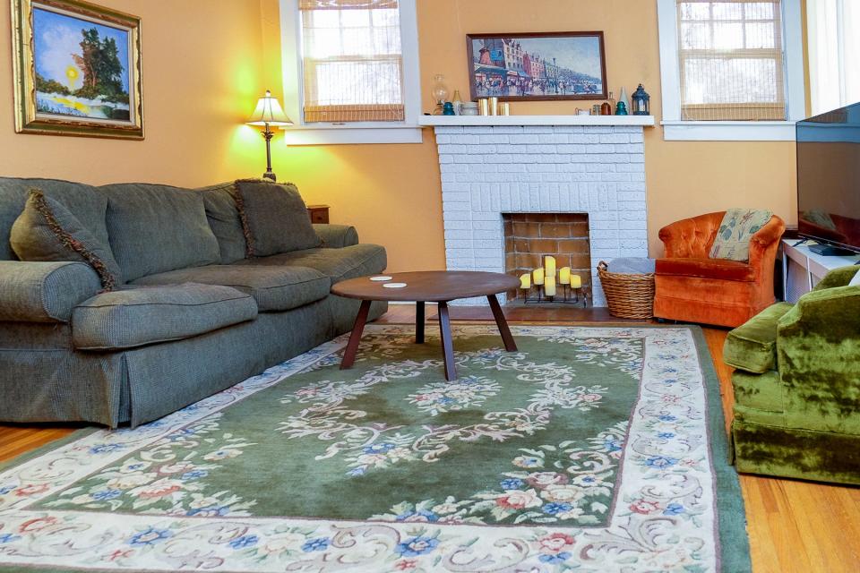 The living room is a colorful and comfortable place to gather.