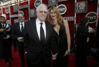 Actor Bruce Dern and his daughter, actress Laura Dern, arrive at the 20th annual Screen Actors Guild Awards in Los Angeles, California January 18, 2014. REUTERS/Mario Anzuoni (UNITED STATES - Tags: ENTERTAINMENT) (SAGAWARDS-ARRIVALS)