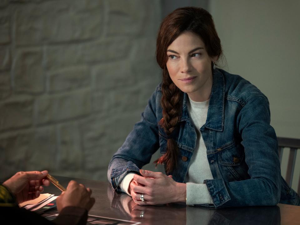 Michelle Monaghan on Echoes sitting at table with hands clasped