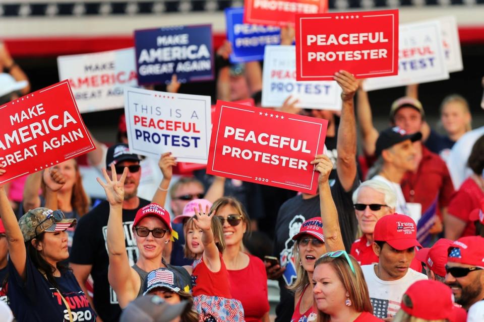 Supporters of President Donald Trump gather at the Minden-Tahoe Airport in Minden, Nev., on Sept. 12, 2020. 