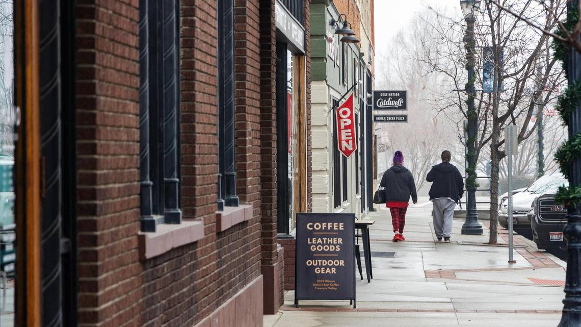 Shoppers walk along 7th Avenue at Indian Creek Plaza. Local leaders have made a concerted effort to bring back the downtown area. Their work is finally paying off.