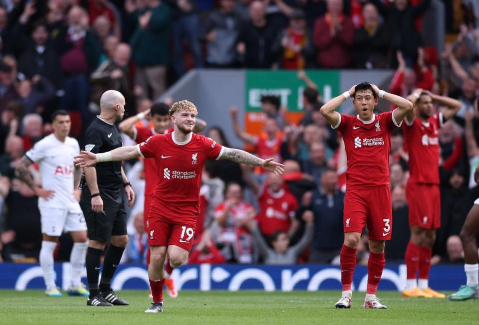 The Liverpool players are stunned by Harvey Elliott’s goal (EPA)
