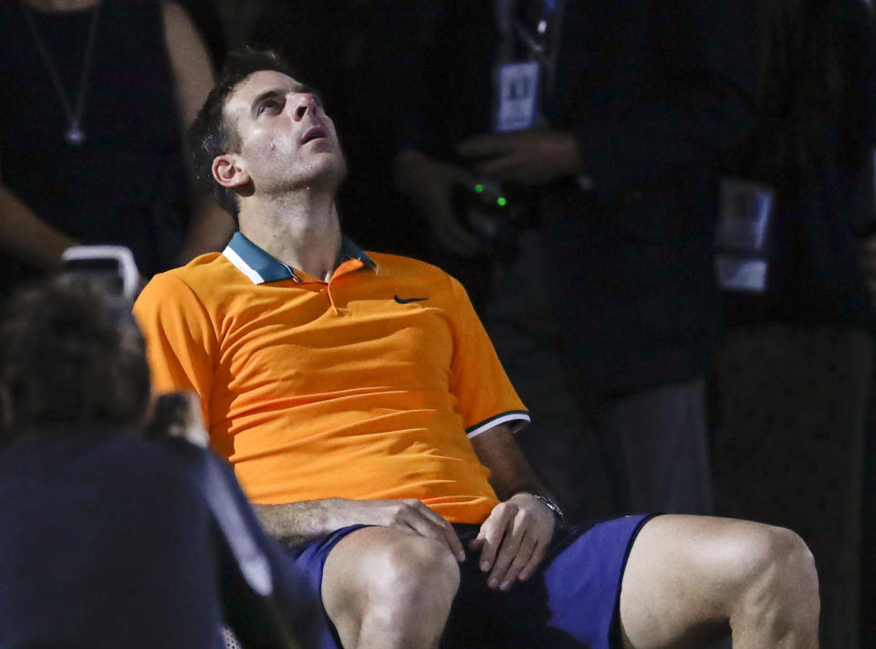 Juan Martin del Potro, of Argentina, waits for the trophy ceremony after losing to Novak Djokovic, of Serbia, in the men's final of the U.S. Open tennis tournament, Sunday, Sept. 9, 2018, in New York. (AP Photo/Julio Cortez)