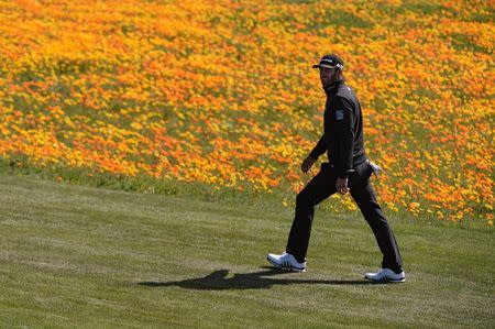 Feb 10, 2018; Pebble Beach, CA, USA; Dustin Johnson walks the eighth fairway during the third round of the AT&T Pebble Beach Pro-Am golf tournament at Pebble Beach Golf Links. Mandatory Credit: Orlando Ramirez-USA TODAY Sports