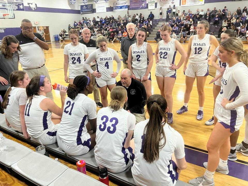 DeSales coach Erick Herzberg talks to his team during a 40-37 loss to visiting Watterson on Thursday.