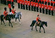 <p>The Queen arrives on horseback. </p>