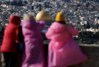 People look towards the Dome of the Rock on the compound known to Jews as Temple Mount and to Palestinians as Noble Sanctuary in Jerusalem's Old City