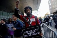 Glenn Cantave rallies with other demonstrators outside the location of the annual NFL owners meeting in New York City, NY, U.S. October 17, 2017. REUTERS/Shannon Stapleton