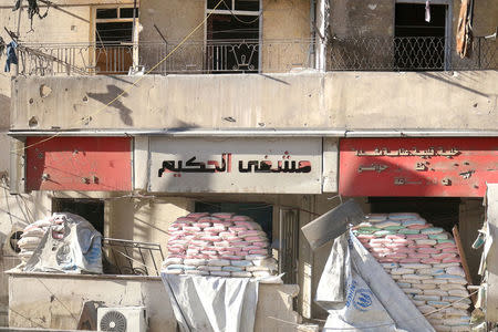 FILE PHOTO: Sandbags are stacked on the entrances of damaged al-Hakeem hospital, in the rebel-held besieged area of Aleppo, Syria November 19, 2016. REUTERS/Abdalrhman Ismail/File Photo