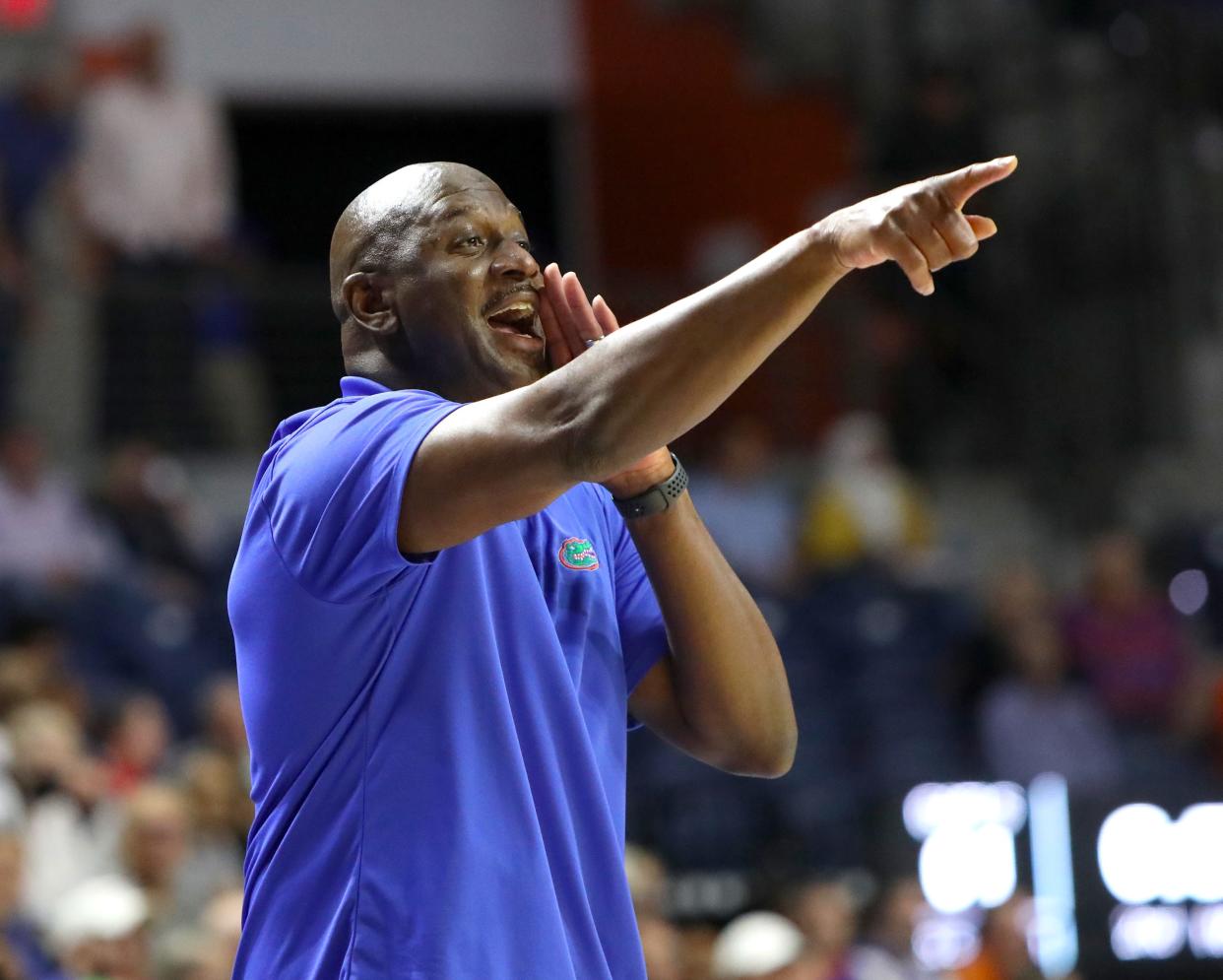 University of Florida interim head coach Al Pinkins yells to his players during the opening round of the NIT basketball tournament against Iona, at the Exactech Arena in Gainesville Fla. March 16, 2022. The Gators beat the Gales 79-74 to advance in the tournament.