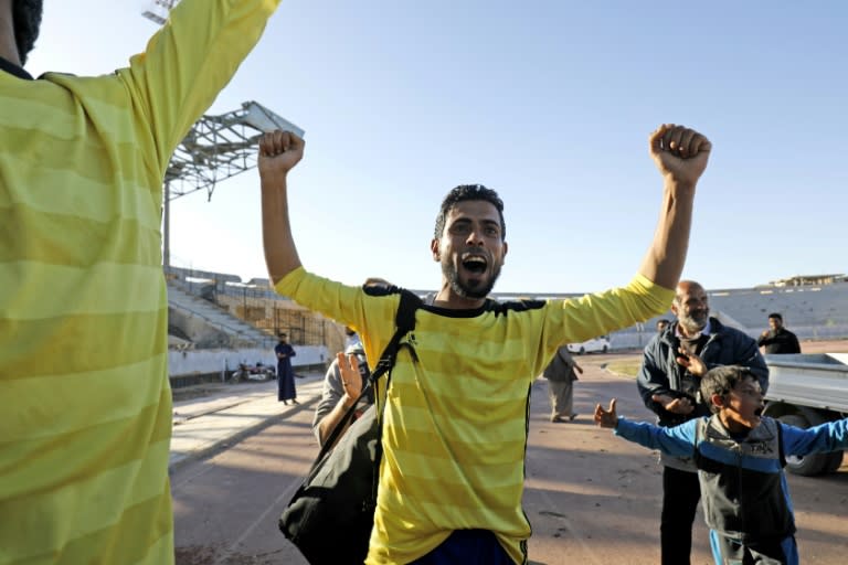 A player celebrates after a football match on April 16, 2018 at a stadium in Syria's Raqa that the Islamic State group used as a prison