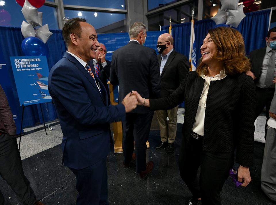 Vin Perrone, president and CEO of Veterans Inc., greets Lt. Gov. Karyn Polito during a Massport ceremony at Worcester Airport.