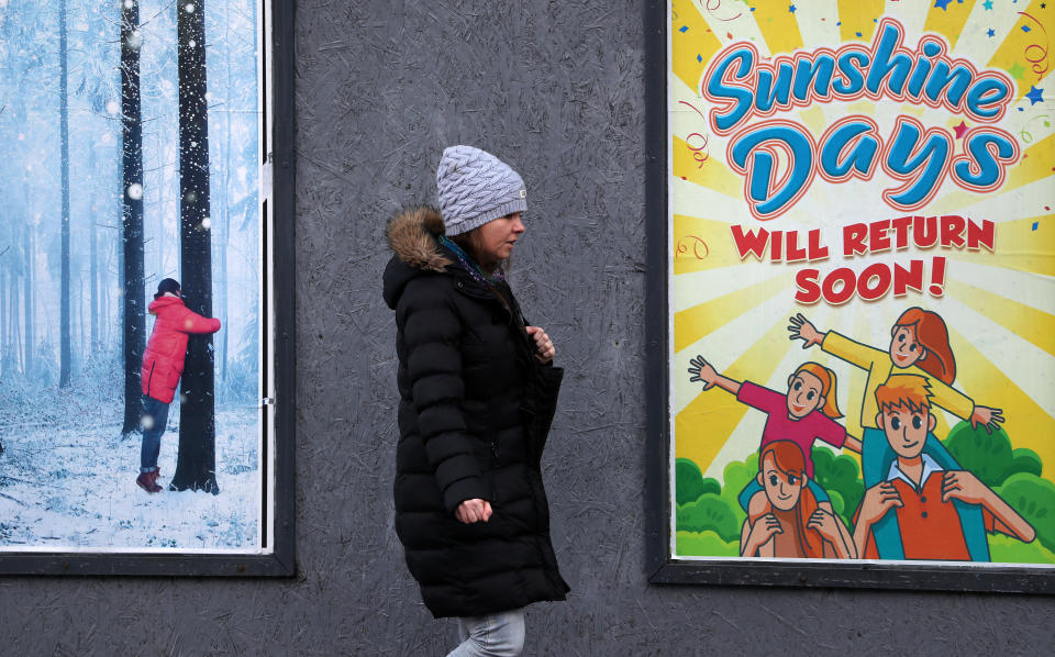 <p>A person walks passed an advertising board in Glasgow showing an advert from the Pavilion Theatre, as lockdown measures for mainland Scotland continue. Picture date: Friday March 12, 2021.</p>
