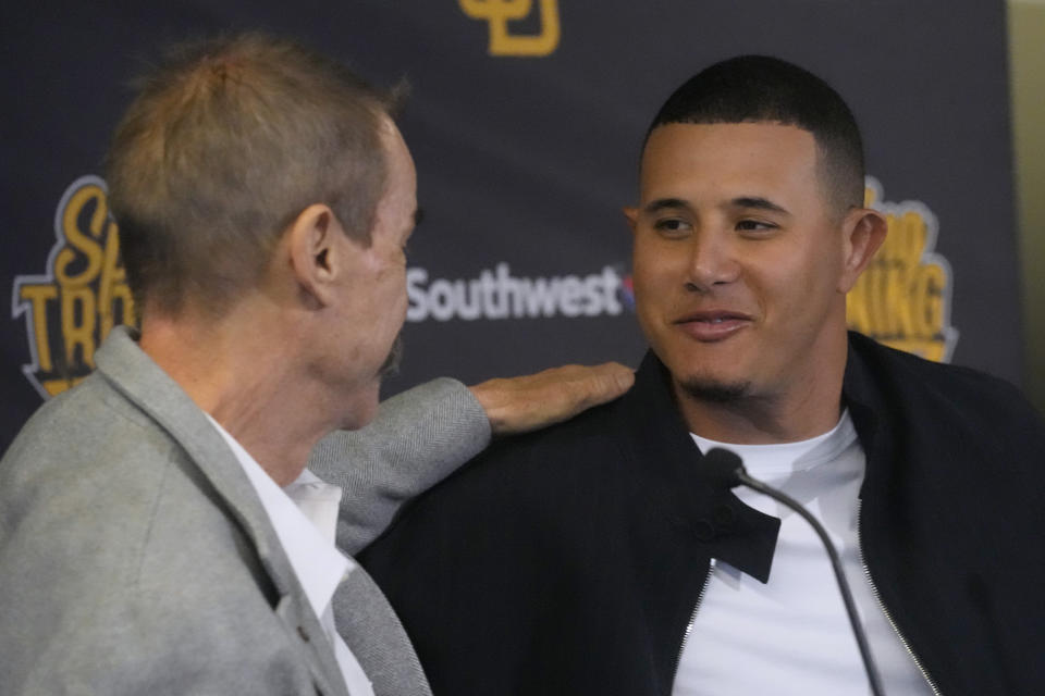 San Diego Padres third baseman Manny Machado talks with owner Peter Seidler during a news conference to discuss his 11-year contract extension Tuesday, Feb. 28, 2023, at the team's spring training baseball facility in Peoria, Ariz. (AP Photo/Charlie Riedel)