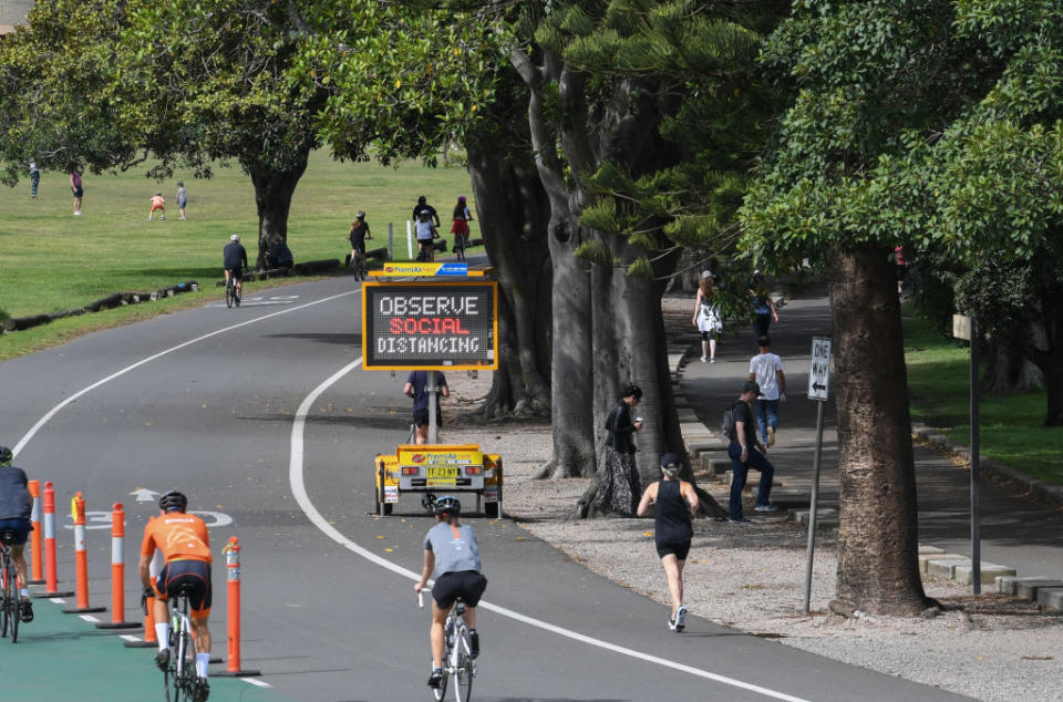 Cyclists and joggers pictured in Centennial park in Sydney. 