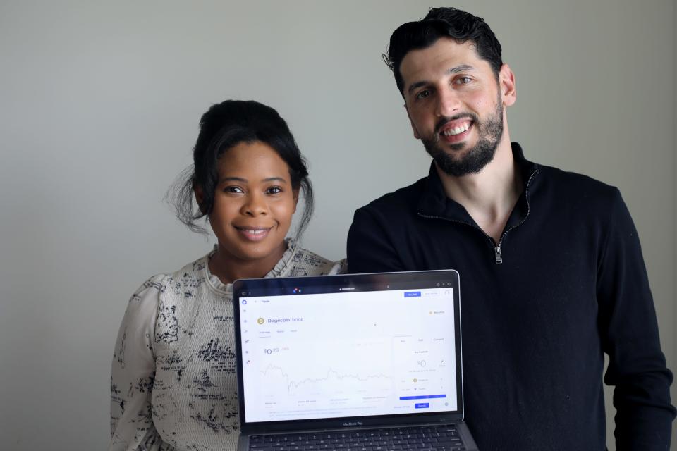 Gabrielle and Hamez Trezhnjeva, of Bayonne, NJ, trade cryptocurrency from their laptop or phones. Monday, August 2, 2021.