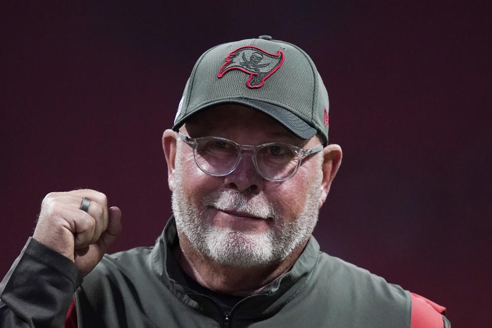 FILE - Tampa Bay Buccaneers coach Bruce Arians walks along the sideline before the team's NFL football game against the Atlanta Falcons on Dec. 5, 2021, in Atlanta. Arians has decided to retire as coach of the Buccaneers and move into a front-office role with the team, it was announced Wednesday night, March 30. Arians, who will turn 70 this coming season, coached the Bucs to the Super Bowl title in the 2020 season — Tom Brady’s first with Tampa Bay. (AP Photo/Brynn Anderson, File)