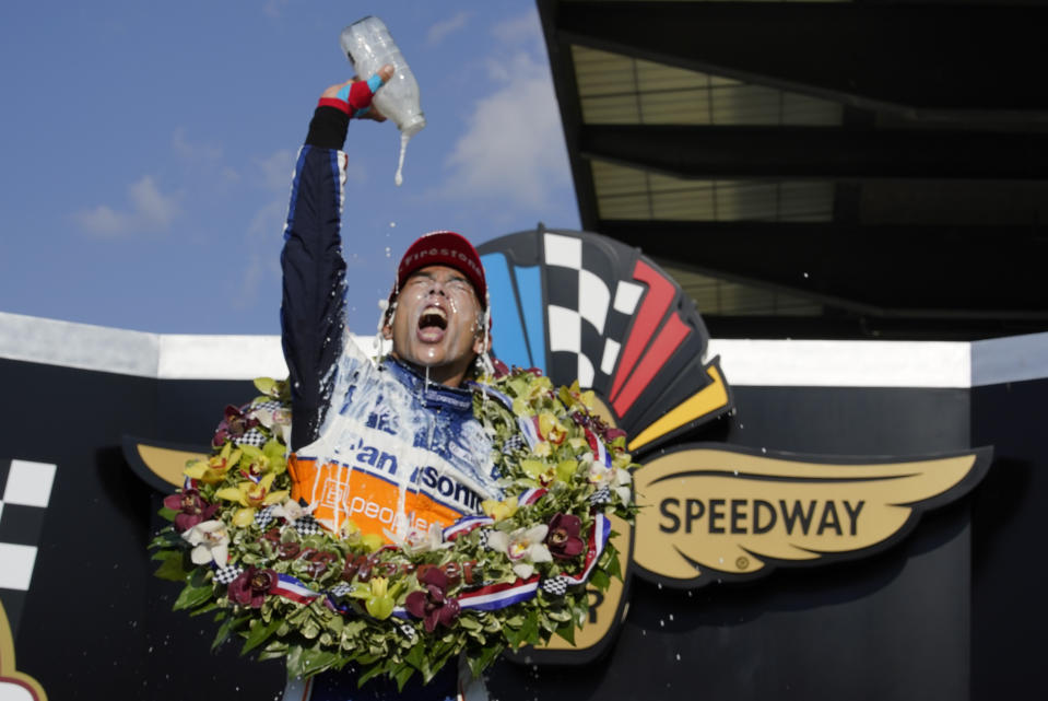 FILE - Takuma Sato, of Japan, celebrates after winning the Indianapolis 500 auto race at Indianapolis Motor Speedway in Indianapolis, in this Sunday, Aug. 23, 2020, file photo. Sato is trying to become the sixth driver to win consecutive Indianapolis 500s. (AP Photo/Michael Conroy, File)